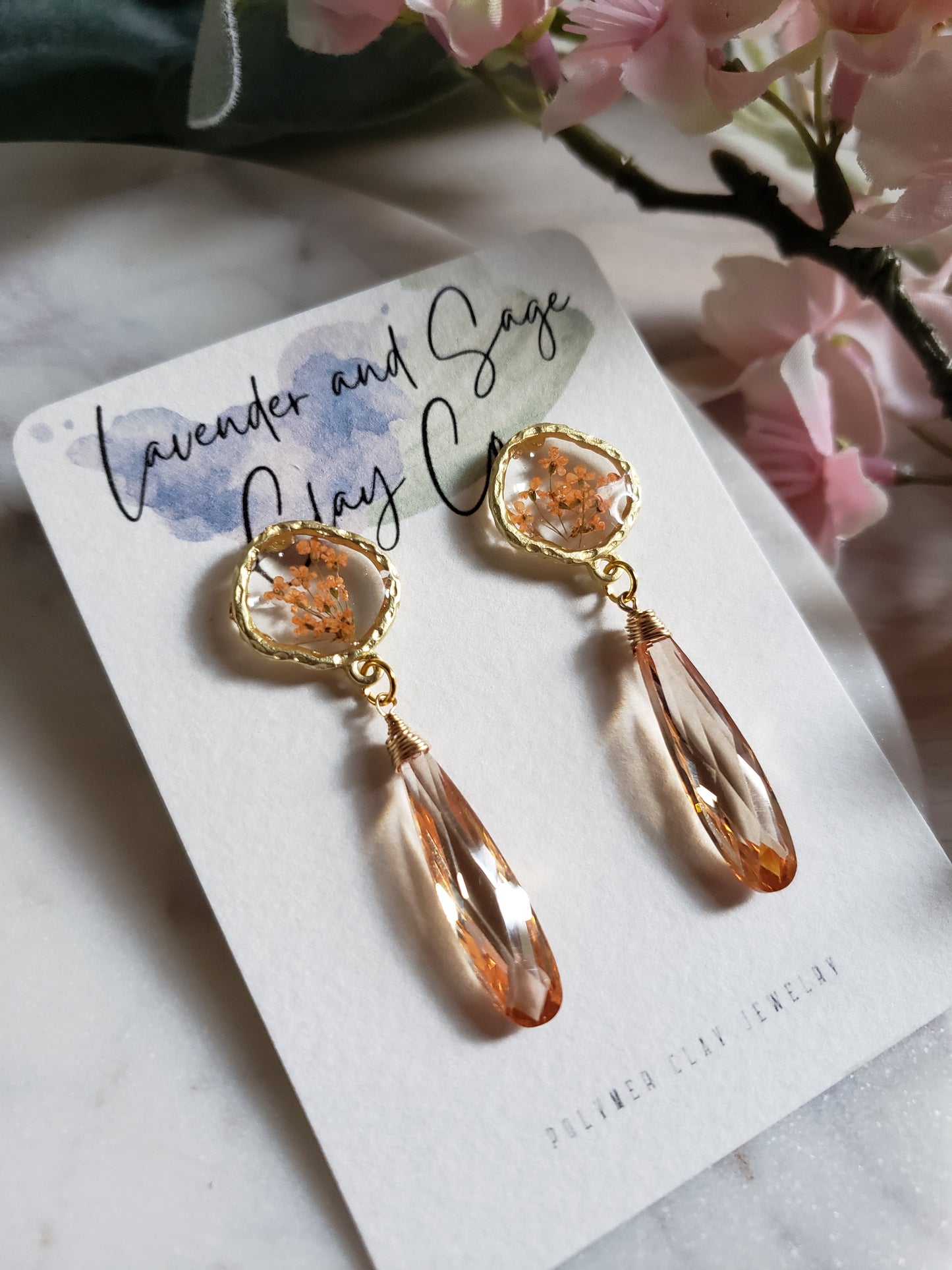 Peach floral resin studs with peach cubic zirconia.  Pantone color of the year