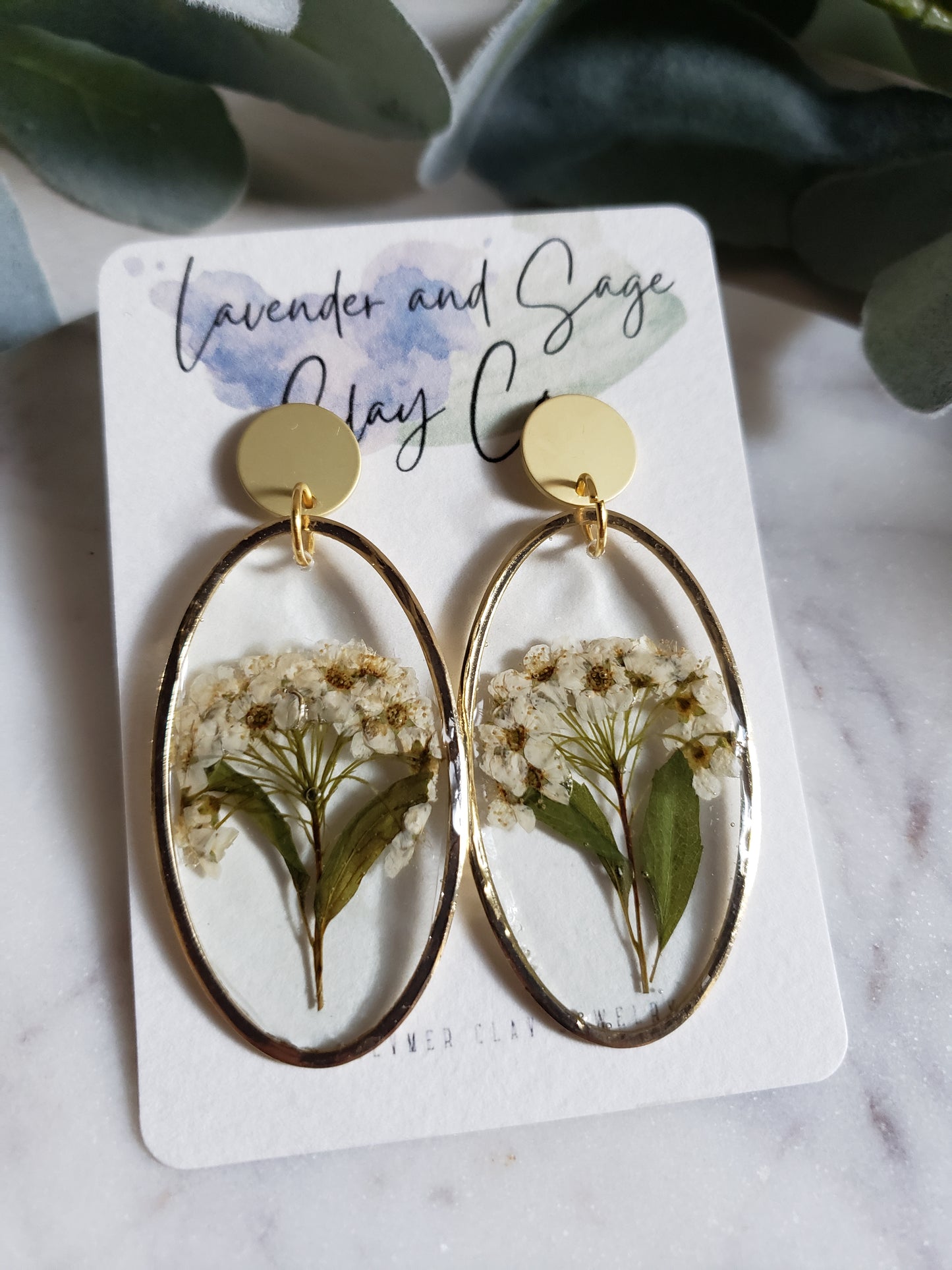 White flower bunch resin statement earrings in gold