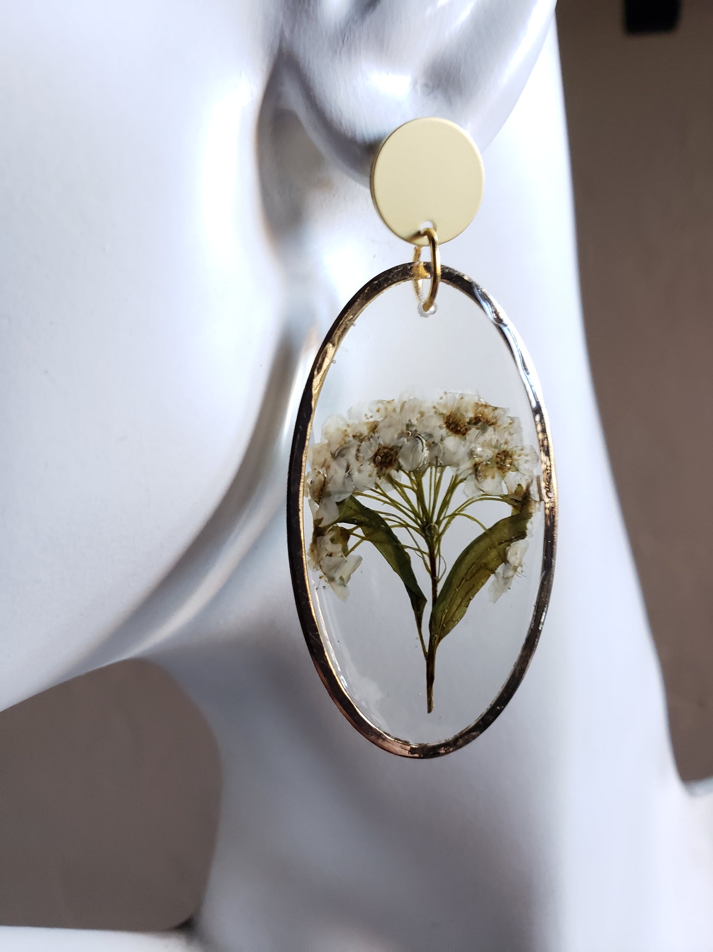 White flower bunch resin statement earrings in gold