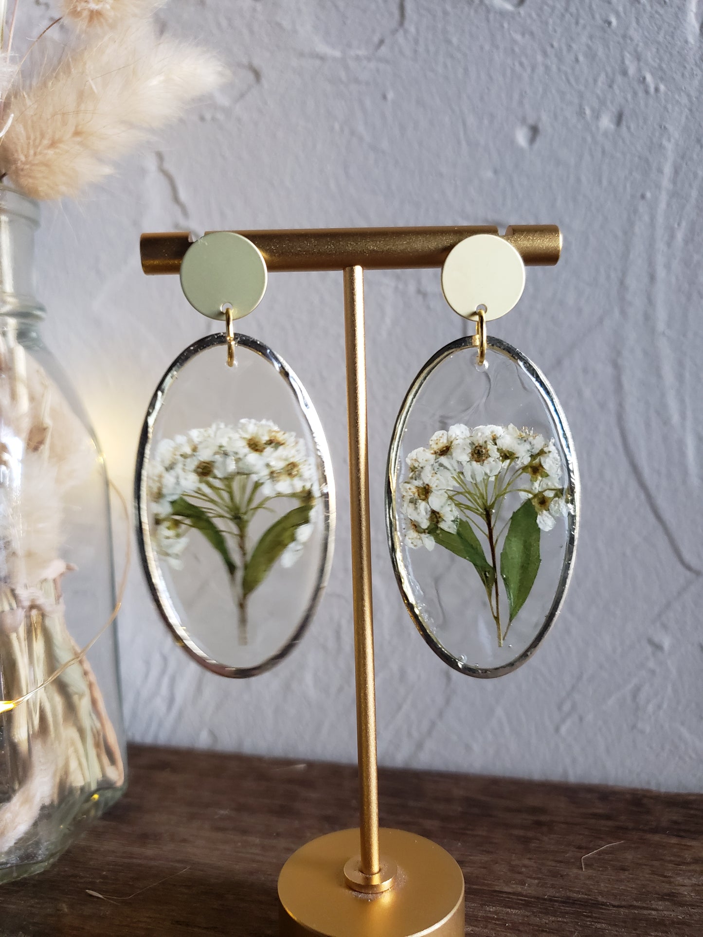 White flower bunch resin statement earrings in gold