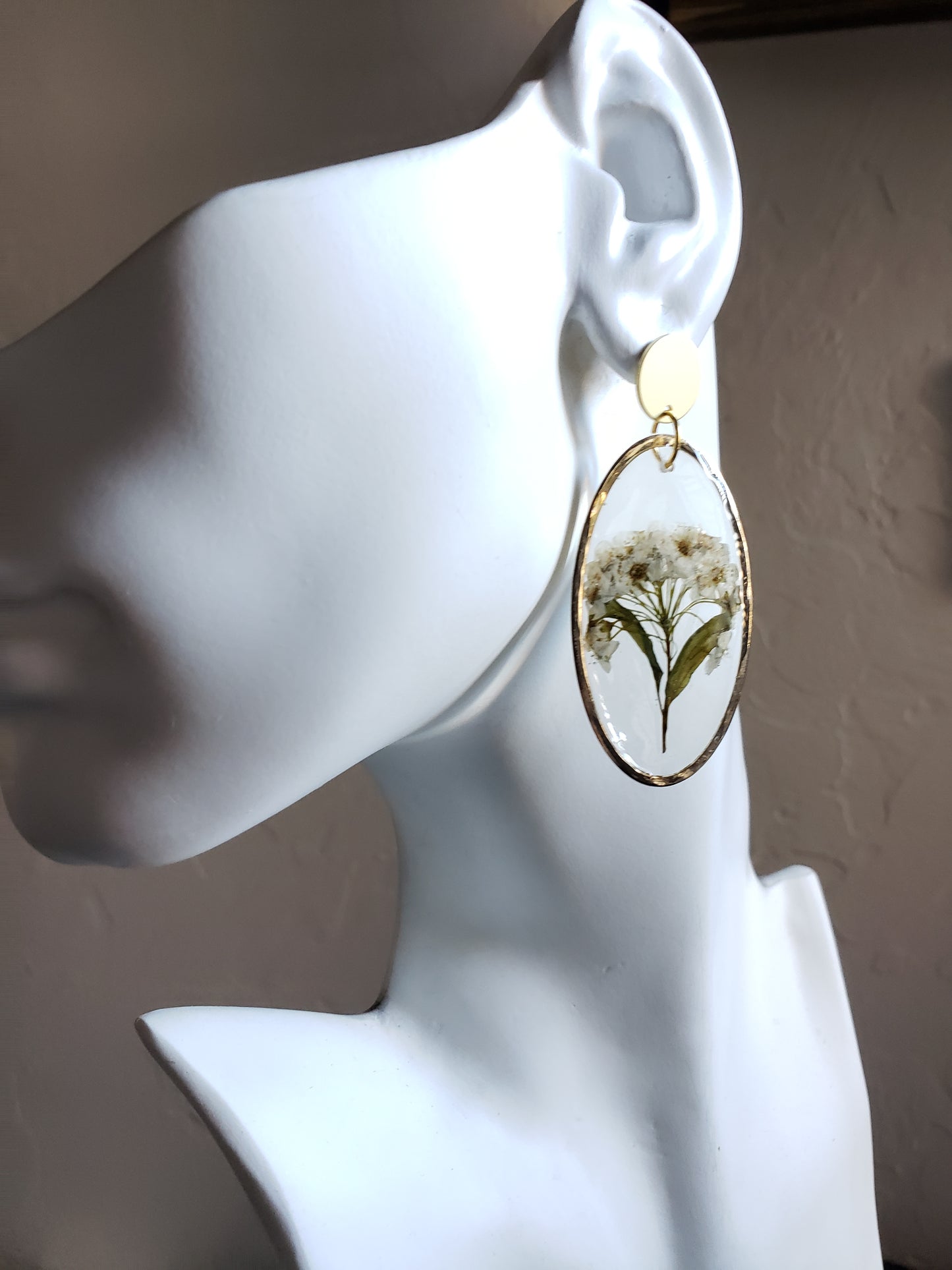 White flower bunch resin statement earrings in gold