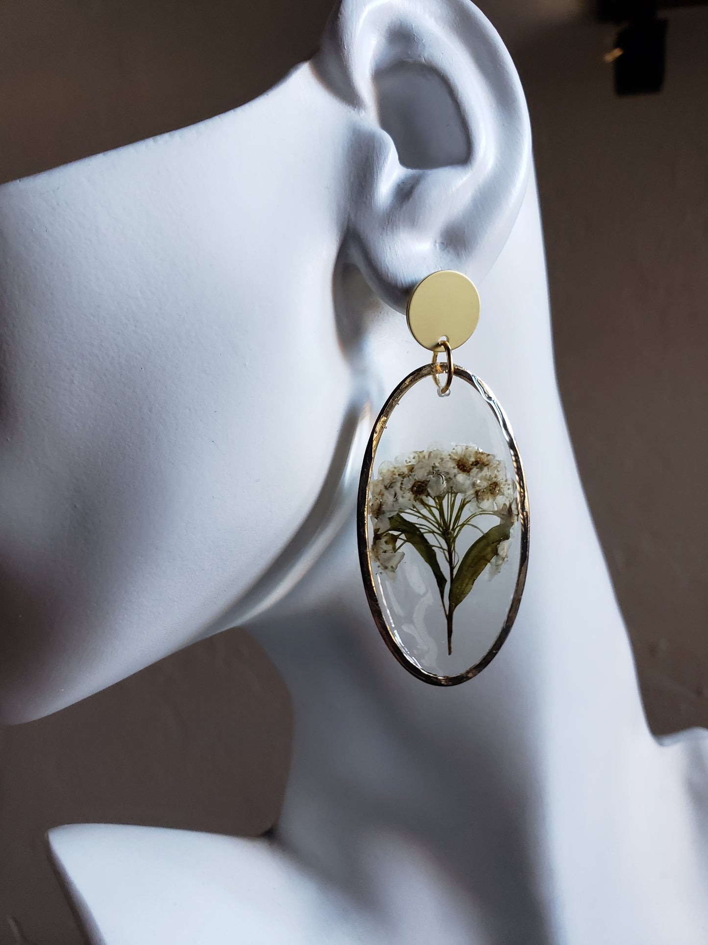 White flower bunch resin statement earrings in gold